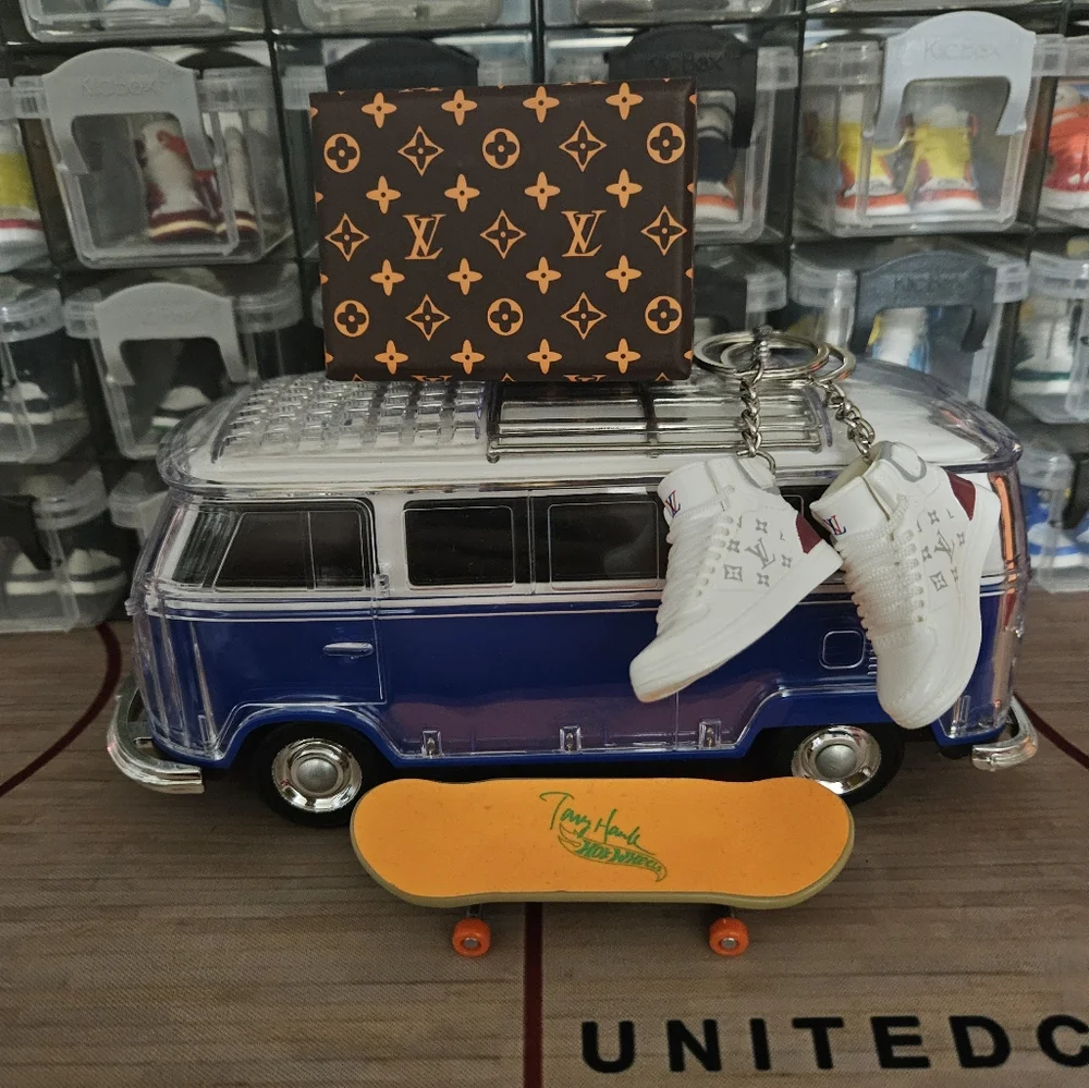 Fashion pair of mini sneakers keychain.